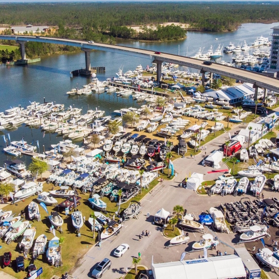 Aerial view of water vessels on display at The Wharf's Annual Boat & Yacht Show in Orange Beach