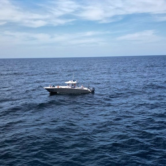 Orange Beach fishing charter boat cruising in the Gulf