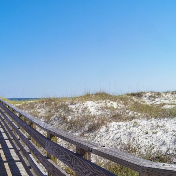 Scenic view of boardwalk on the beach