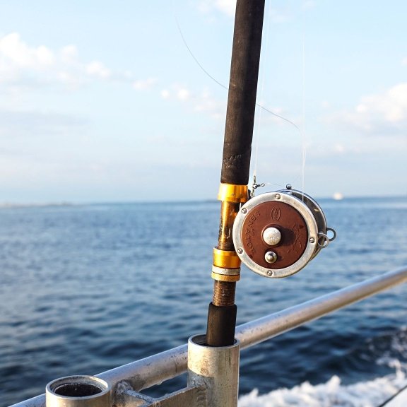 fishing rods lined up on an offshore fishing charter in orange beach