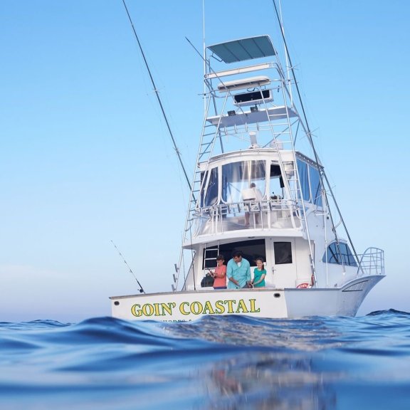 Family casting off on a charter fishing boat in Orange Beach