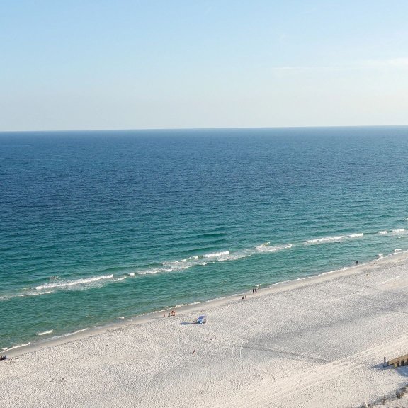 Aerial view of white sand and turquoise waters of Orange Beach