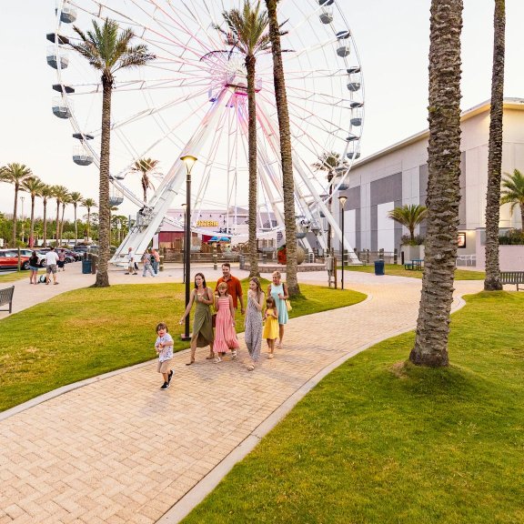 Family walking around The Wharf family-friendly attraction in Orange Beach