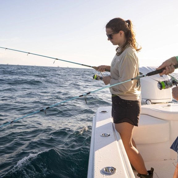 Anglers fishing on an offshore fishing charter in Orange Beach
