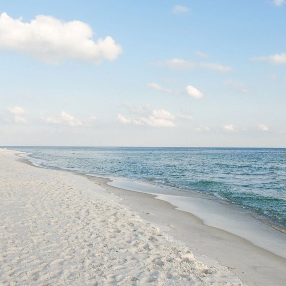Scenic view of white sands and turquoise waters of Orange Beach