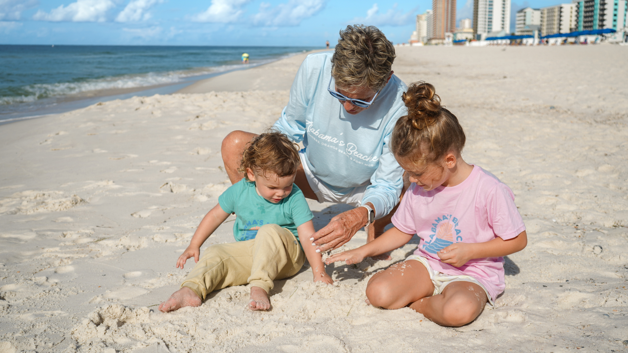 Family in their Alabama's Beaches merch