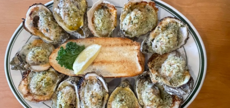 plate of chargrilled oysters at Original Oyster House seafood restaurant in Gulf Shores