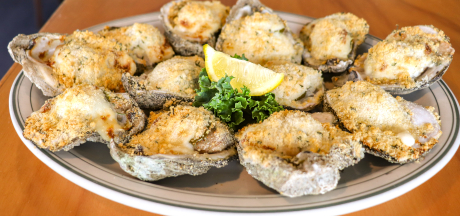 Plate of charbroiled firecracker oysters at Original Oyster House seafood restaurant in Gulf Shores