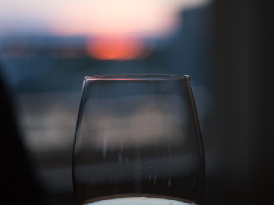 a glass of wine looking at the sunset in Gulf Shores AL