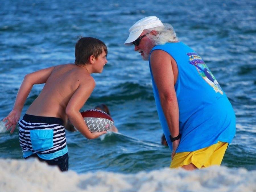 Grandson and Grandfather on the beach in Orange Beach Al