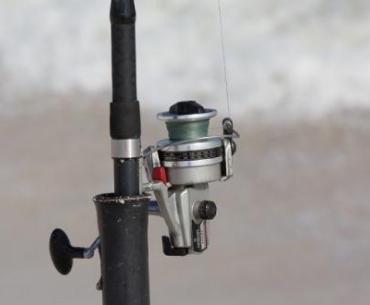 rod and reel on the beach in Gulf Shores AL