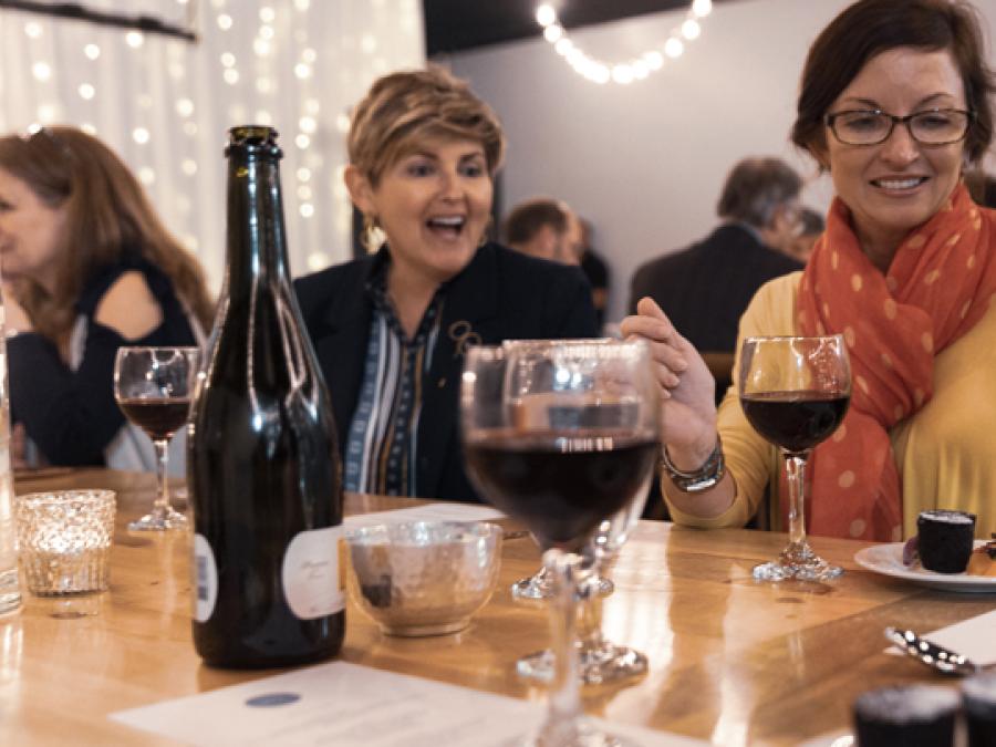 women drinking wine