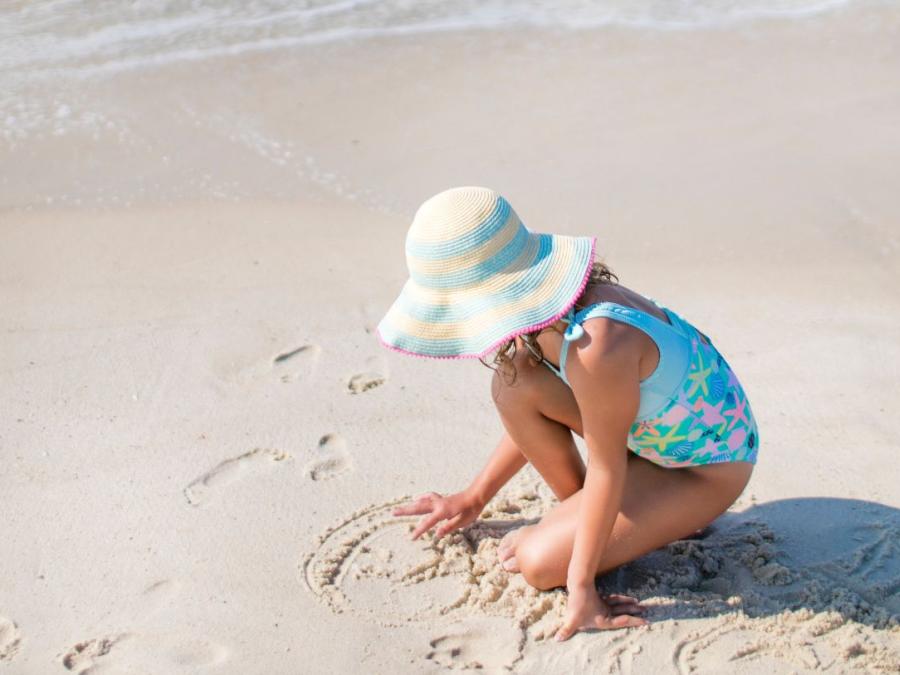 Young girl playing in the sand Gulf Shores, AL