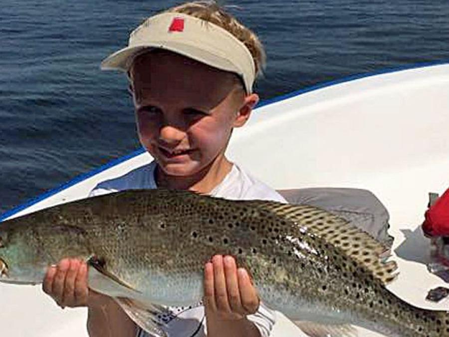 Little boy with a big trout in Gulf Shores, AL