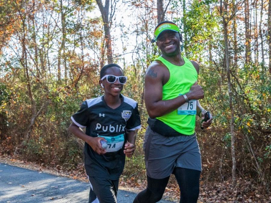 father and son running a race in Orange Beach Al