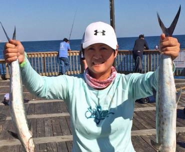 Woman with Spanish mackerel catches on Alabama's beaches