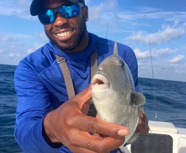 Man holding triggerfish in Gulf of Mexico 