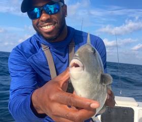 Man holding triggerfish in Gulf of Mexico 