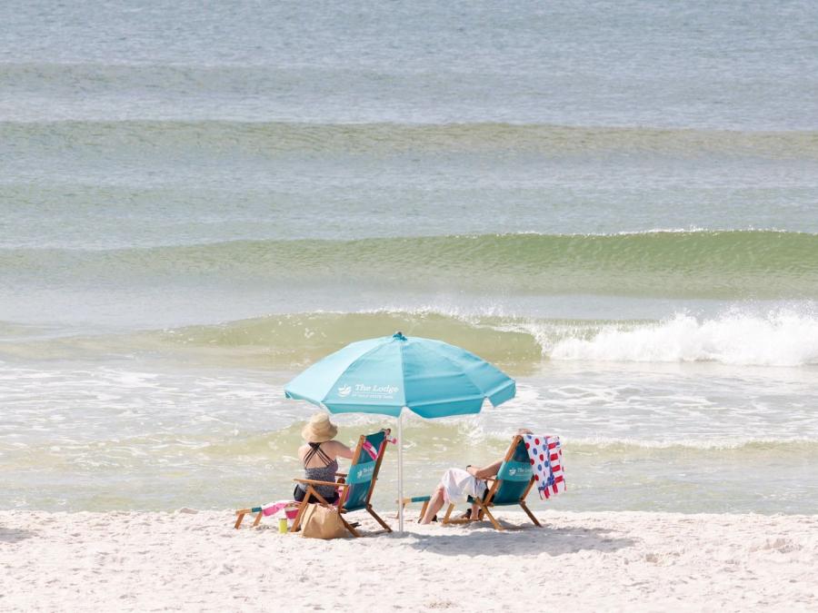 Beach chairs and umbrellas on the beach at The Lodge