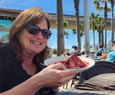 Sara Broers with bread pudding at Cobalt, waterfront restaurant in Orange Beach