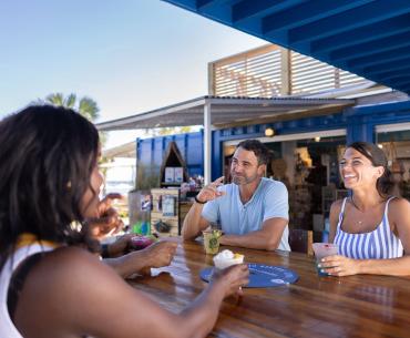 People dining outside at The Gulf waterfront restaurant in Orange Beach