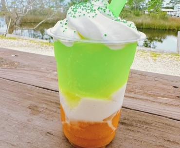 Orange, white, and green St. Patrick's Day daiquiri at High Tide Daiquiris & Mimosas in Gulf Shores