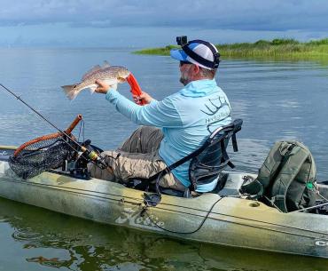 Angler kayak fishing in the back bays of Gulf Shores
