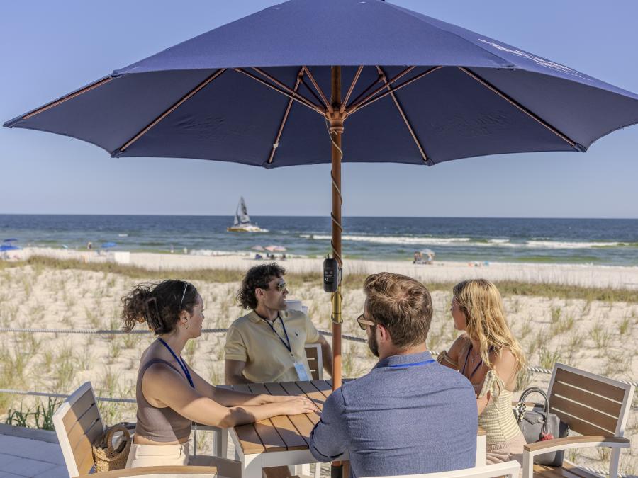 Meeting Attendees enjoying a team dinner at CoastAL in Orange Beach, Alabama