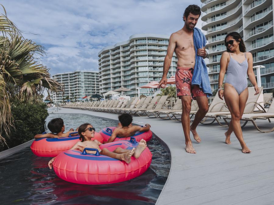 Family enjoying the amenities at their condo rental on Alabama's Beaches