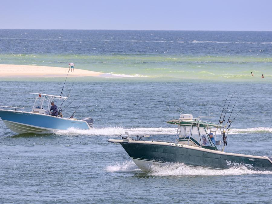 Boats cruising through Perdido Pass in Orange Beach