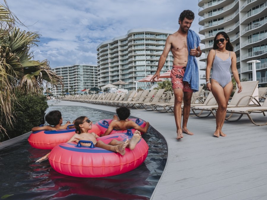 Family enjoying the amenities at their condo rental on Alabama's Beaches