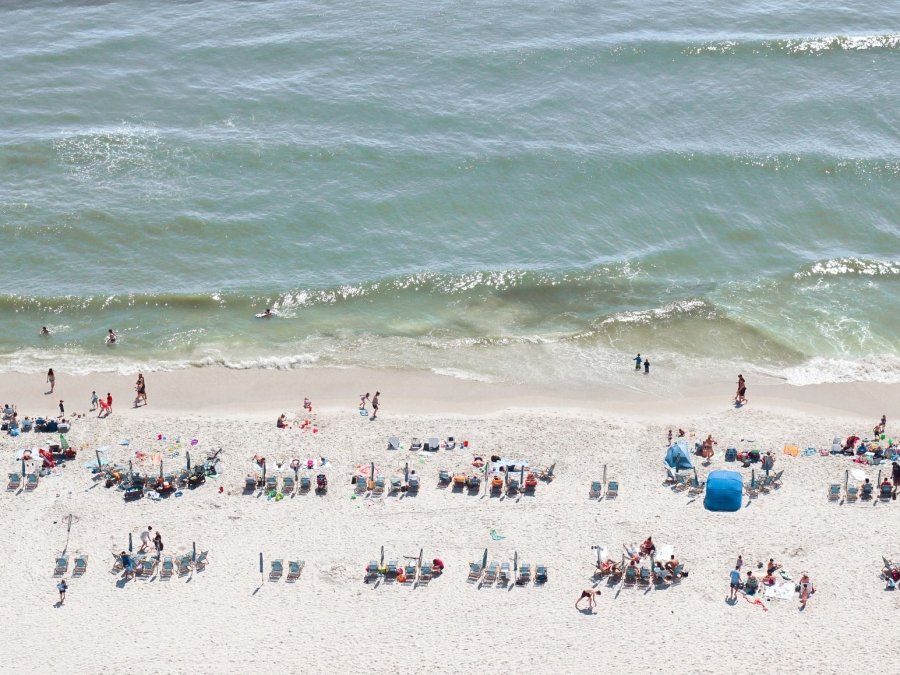 Aerial view of people and chairs on the beach