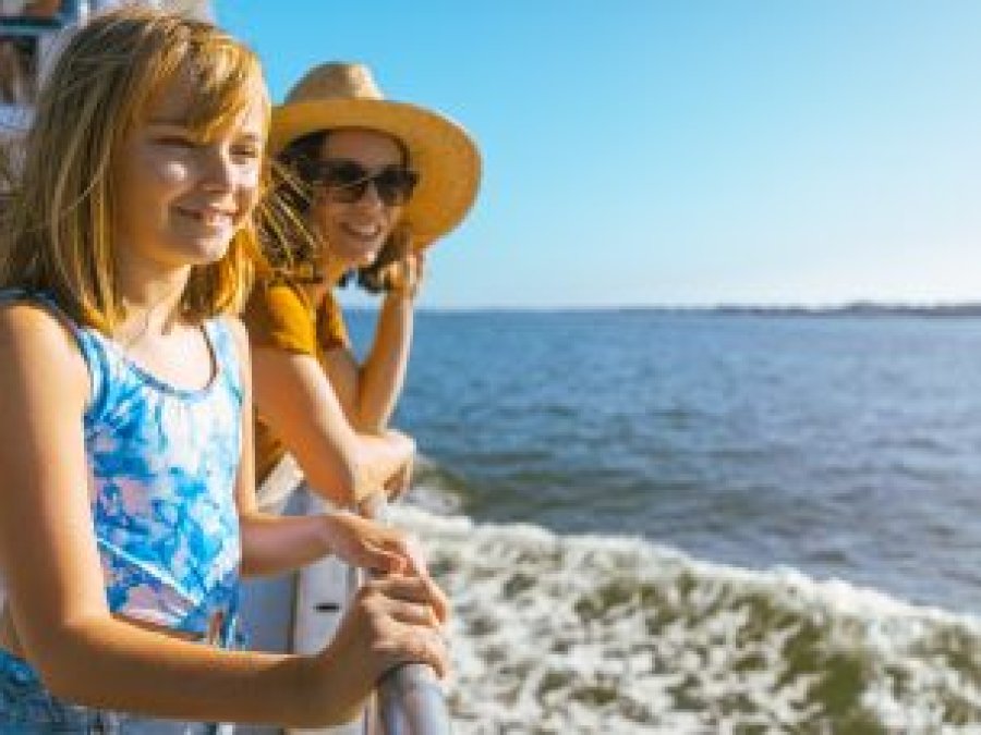 Mom and daughter on a dolphin cruise in Orange Beach