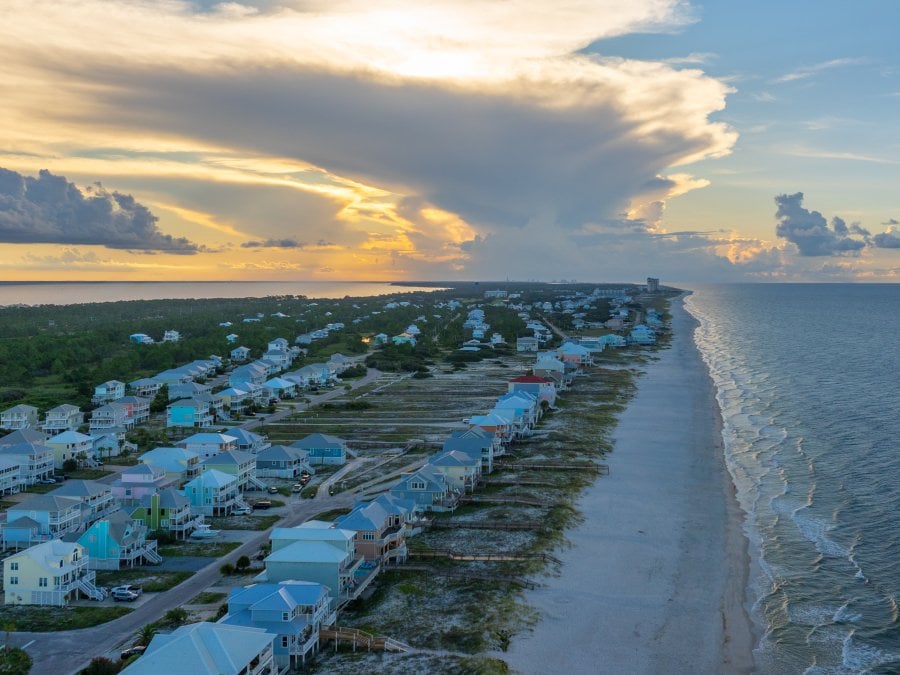 Aerial view of beach houses along the shore in Fort Morgan