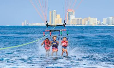 Boy parasailing Orange Beach