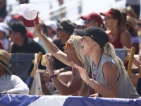 Fans cheering on the players at the NCAA Volleyball Championship on Alabama's Beaches