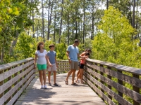 Family walking along the trails in Gulf State Park