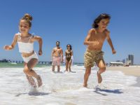 kids running along Alabama's Beaches