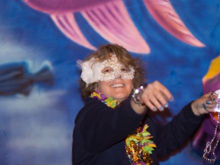 Orange Beach AL Mardi Gras woman throwing beads