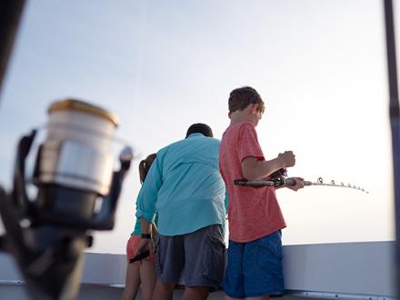 family fishing on a charter boat Orange Beach Al