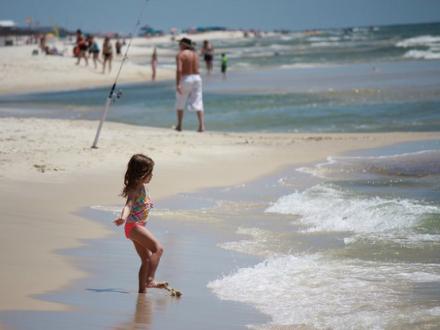 Girl on Gulf Shores beach vacation