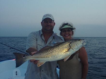 Couple night fishing in Orange Beach