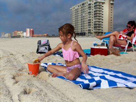 Girl playing on the beach, Gulf Shores and Orange Beach, AL