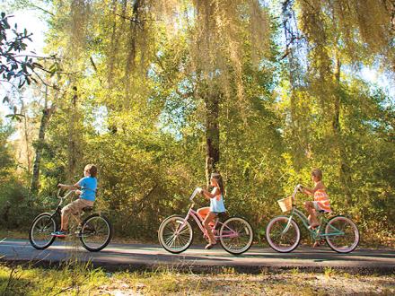 Kids biking on Hugh S Branyon Backcountry Trail in Gulf Shores AL