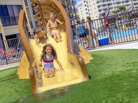 kids play at condo water park pool