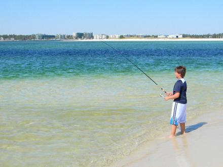 Boy Surf Fishing in Orange Beach AL