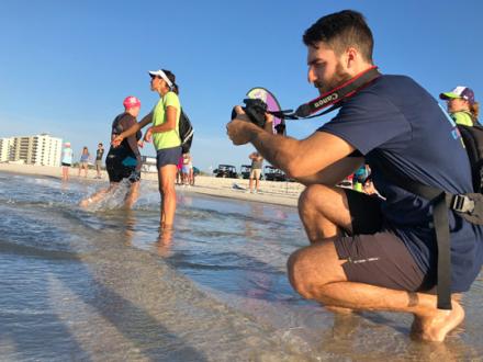 Sports photographer at the beach