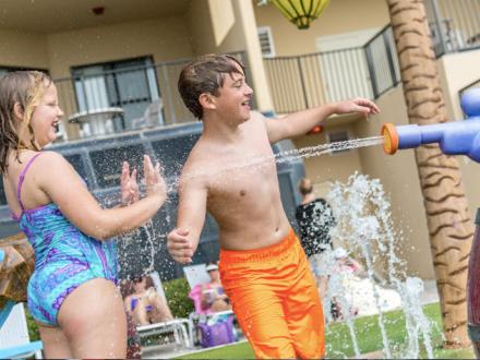 Kids play in water at Brett-Robinson Condo