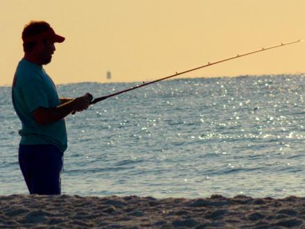 Man surf fishing in Orange Beach