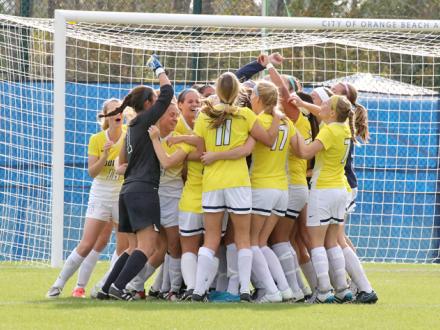 Womens Soccer Team celebrates in Gulf Shores